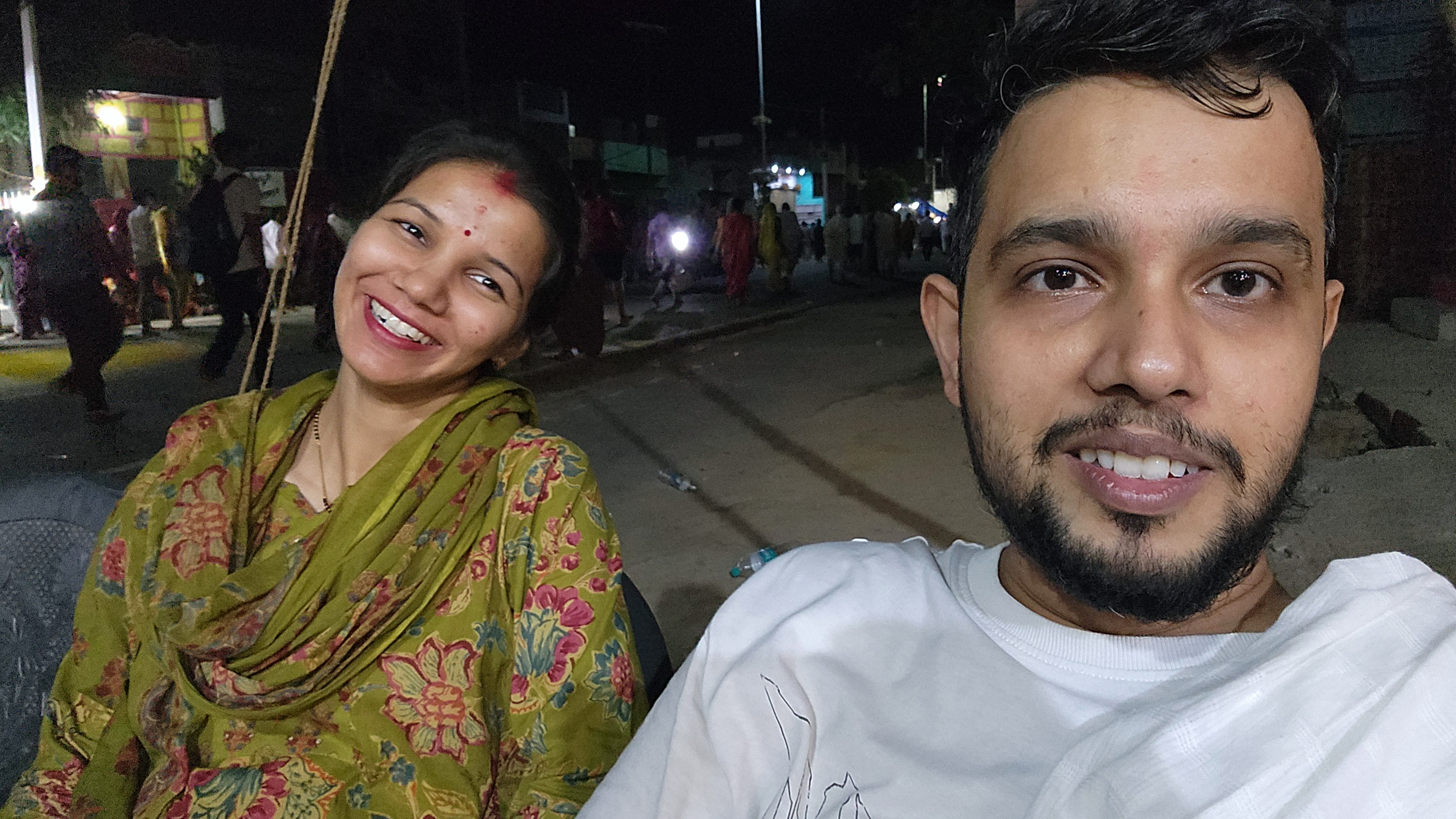 Couple smiling together during a late-night outing