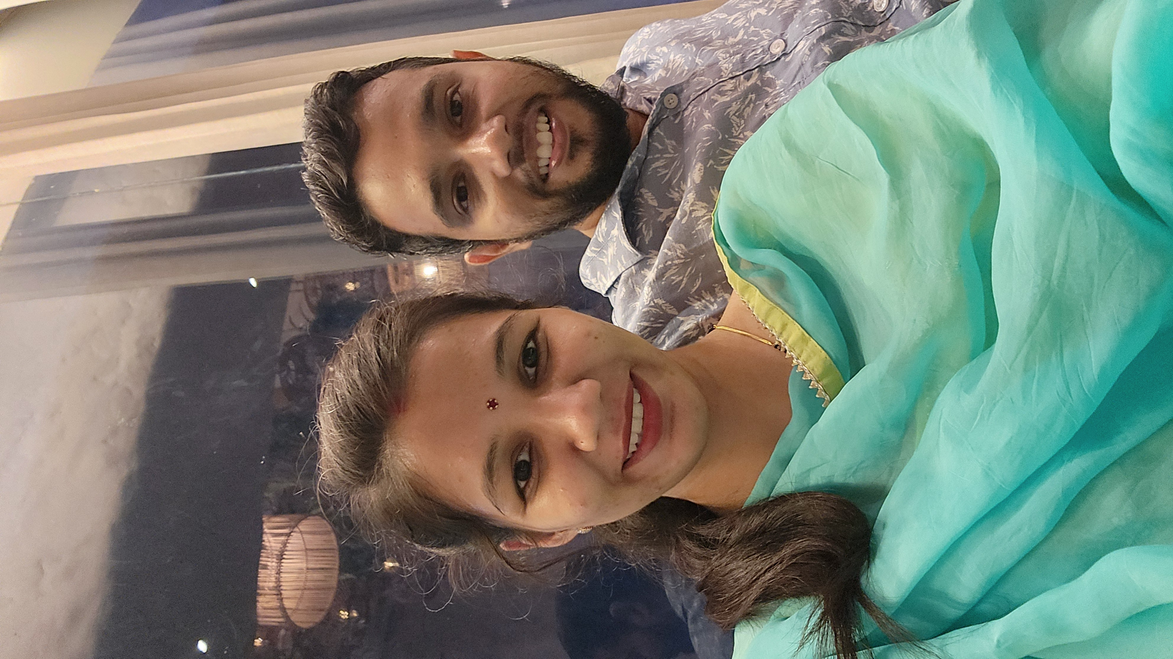 Couple smiling together in elegant traditional clothes